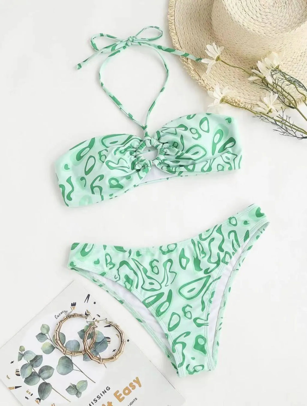 Women's blue floral bandeau bikini with split design and backless styling for swimming