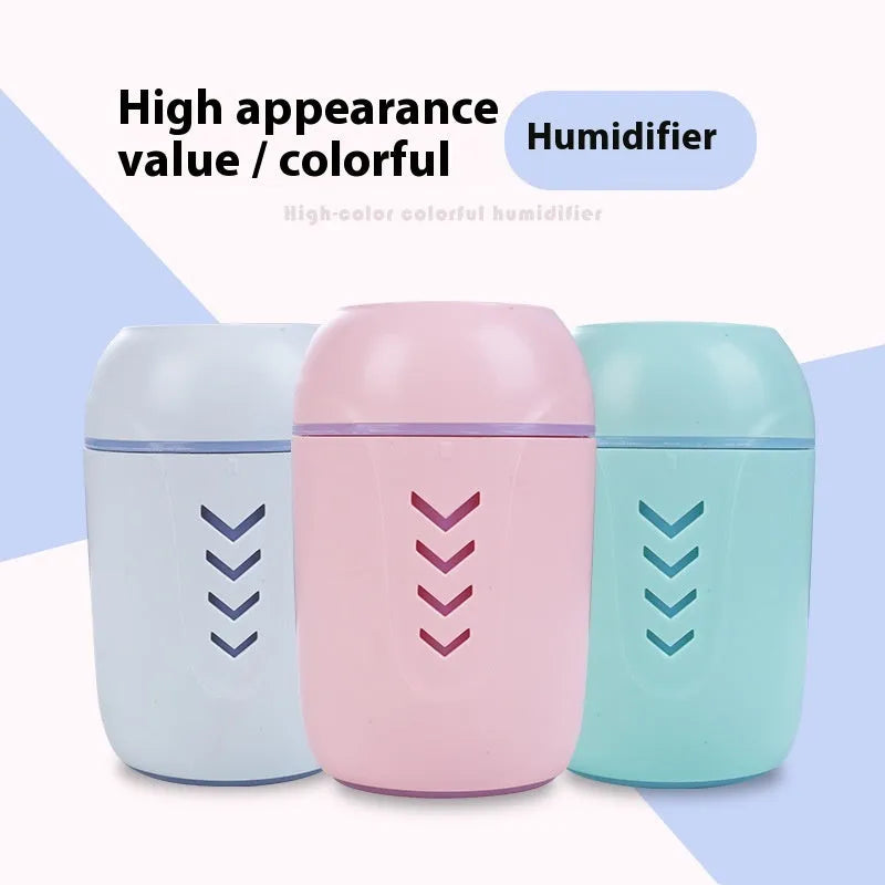 Compact round USB portable air purifier in blue, pink, or white for car and desktop use.