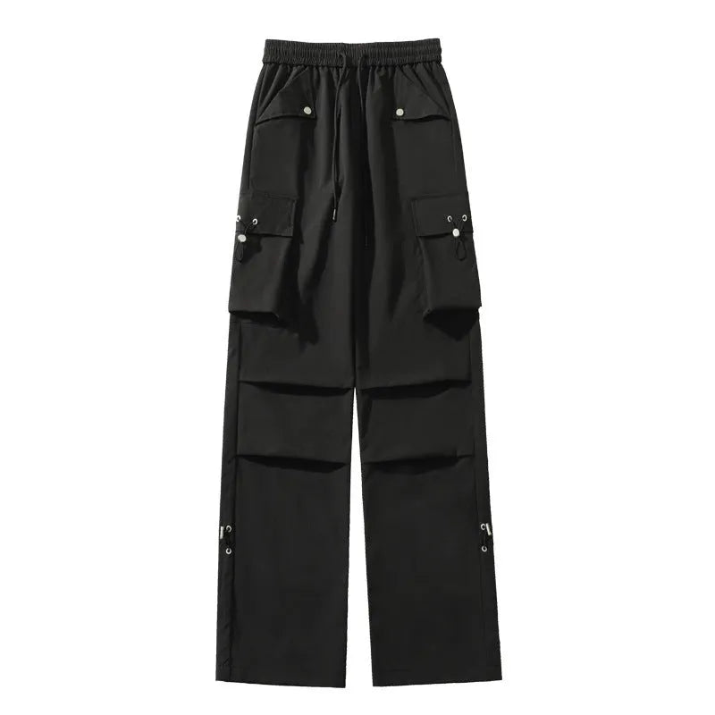Plus size women's thin waterproof trousers in grey with a drawstring waist and straight leg.