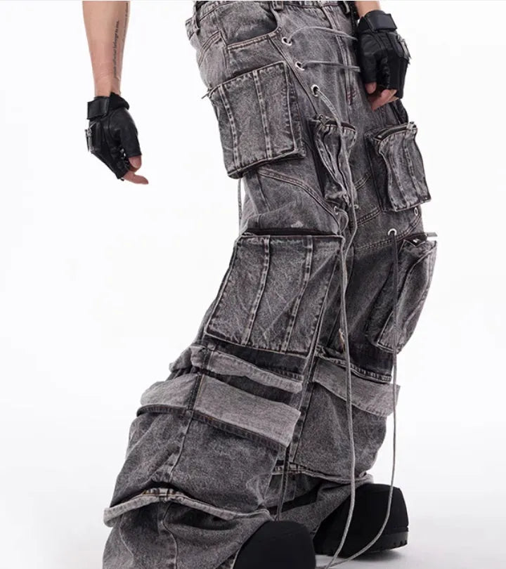 Women's grey distressed denim overalls with mop pant silhouette and rope stitching details