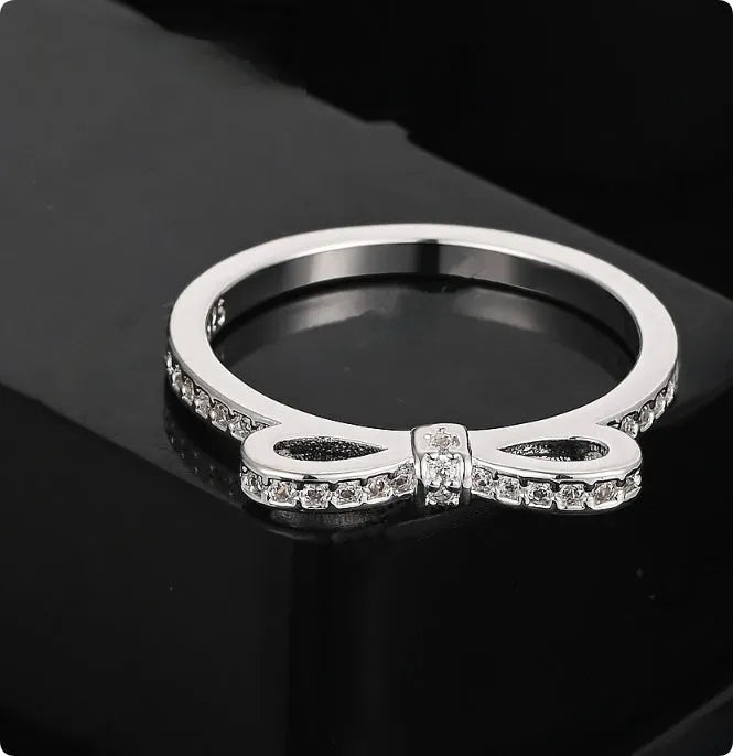 Silver bow-shaped ring with crystal zircon rhinestones in couple style design