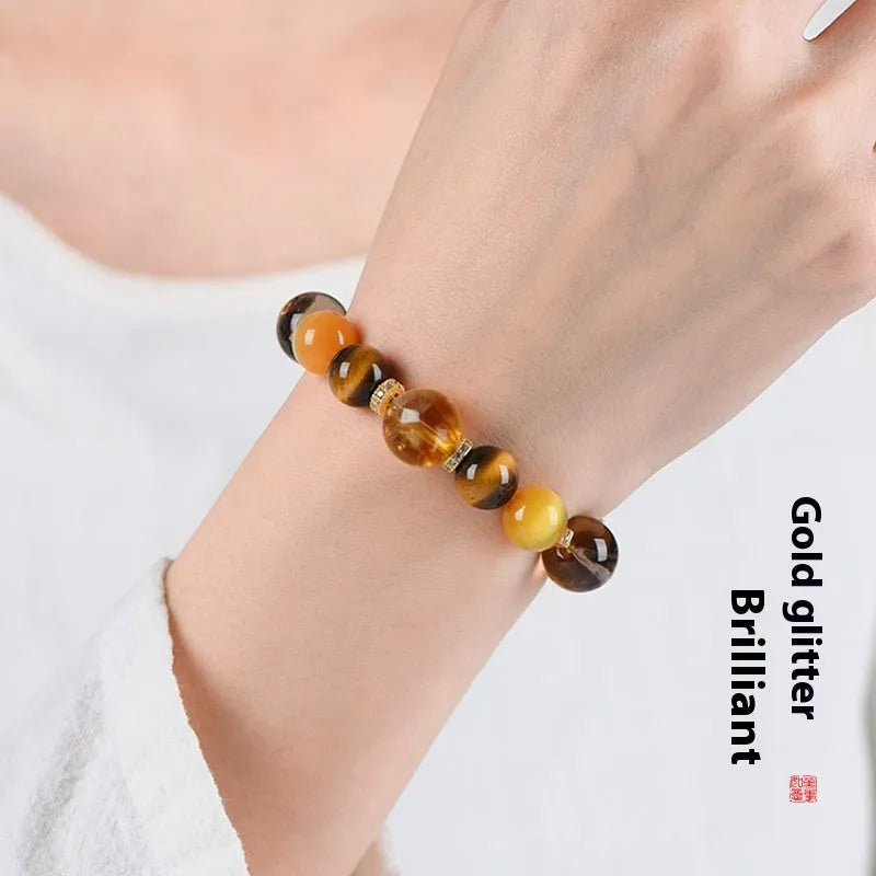 Natural yellow 10mm Jinba crystal beads on a handmade wrap bracelet.
