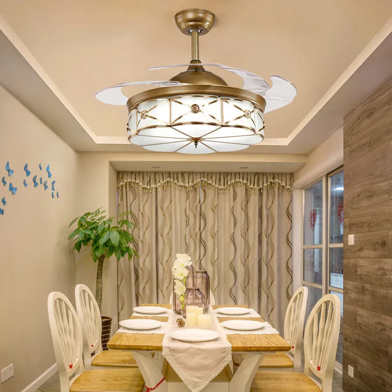 Gold 42-inch ceiling fan light with invisible blades and remote control on a white ceiling