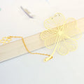 Brass metal hollow plated bookmark with leaf design and rose gold tassel