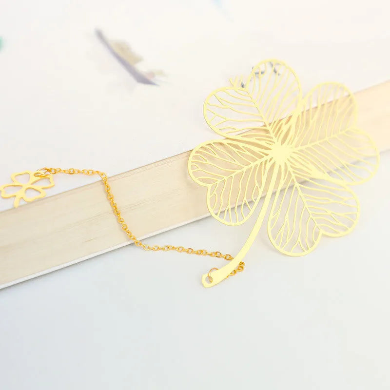 Brass metal hollow plated bookmark with leaf design and rose gold tassel