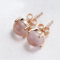 Rose gold plated copper stud earrings with synthetic ross quartz and crystal inlay in drop shape
