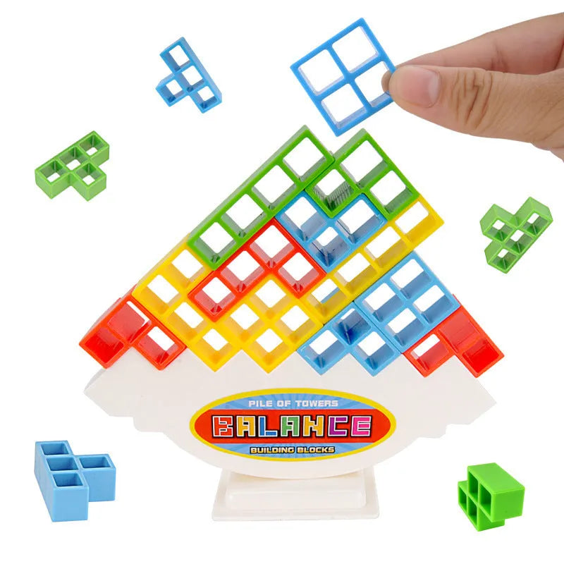 Plastic balance stacking board game with 16 coloured blocks, chassis, and base on a table