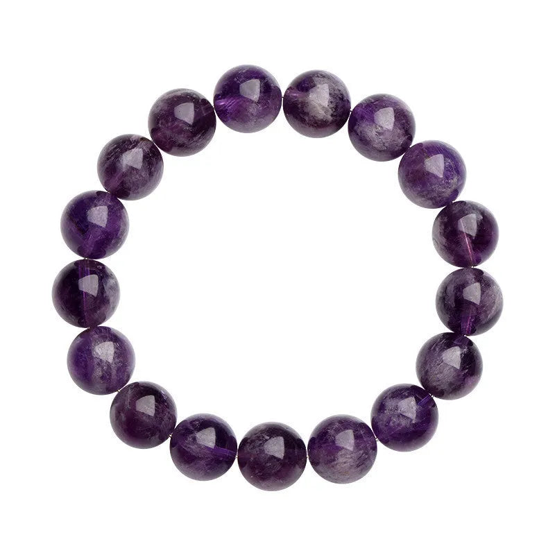 Natural feather amethyst crystal bracelet with geometric scattered beads and Ruyi design on a wrist.