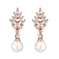 Geometric drop earrings with pearl and micro inlaid zircon, available in gold, platinum, and rose gold plating.