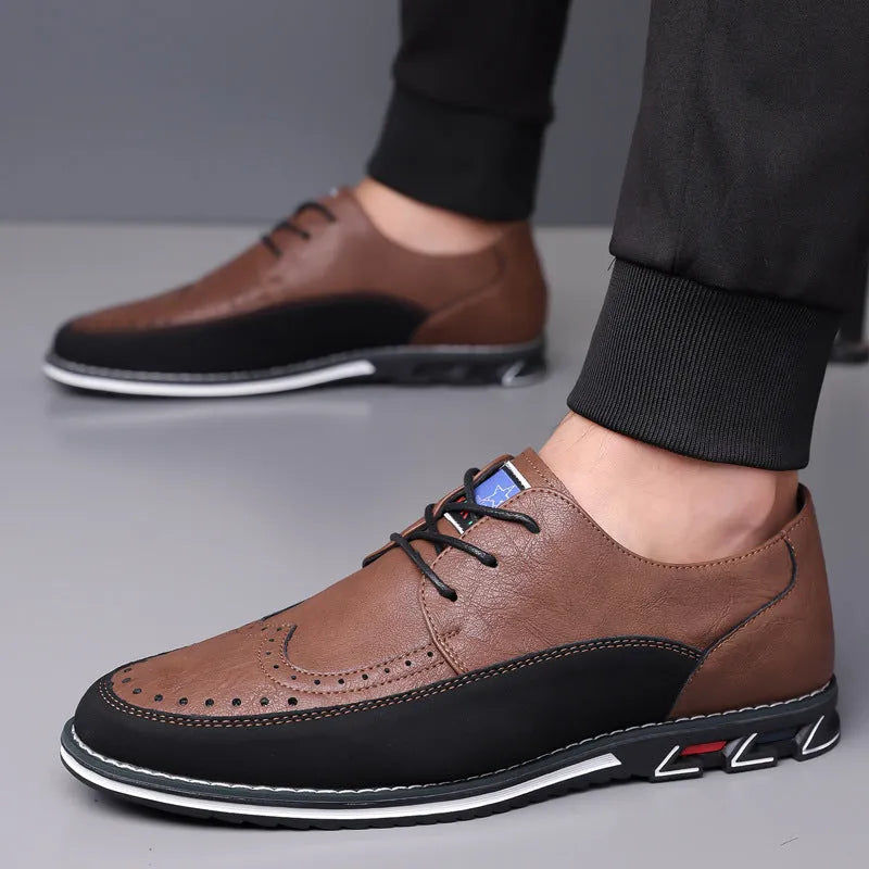 Men's black casual slip-on shoe with leather toe cap and decorative stitching on fabric upper.