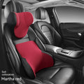 Black memory foam car lumbar support pillow and matching headrest with knitted fabric.