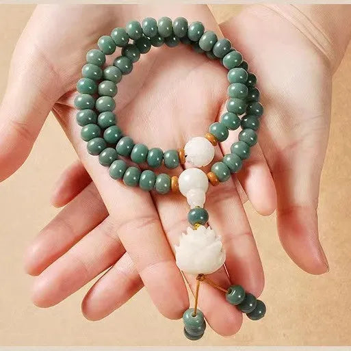 White jade Bodhi green sandalwood bracelet with beaded design and double ring safety buckle clasp.