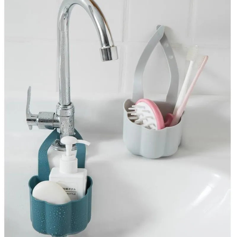 Nordic-style plastic sink drain basket in dark blue, measuring 20cm by 10cm.