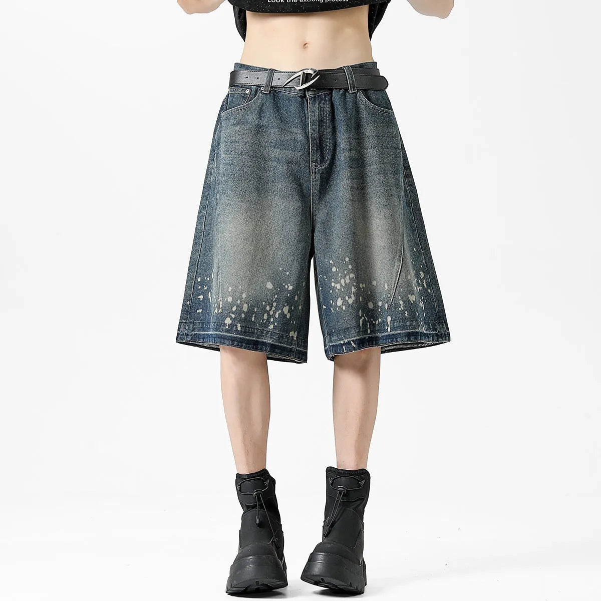 Men's straight cut denim shorts with retro blue wash and ripped splash ink details