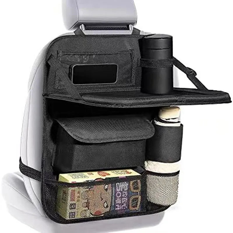 Black Oxford cloth buggy storage bag hanging from car seat back