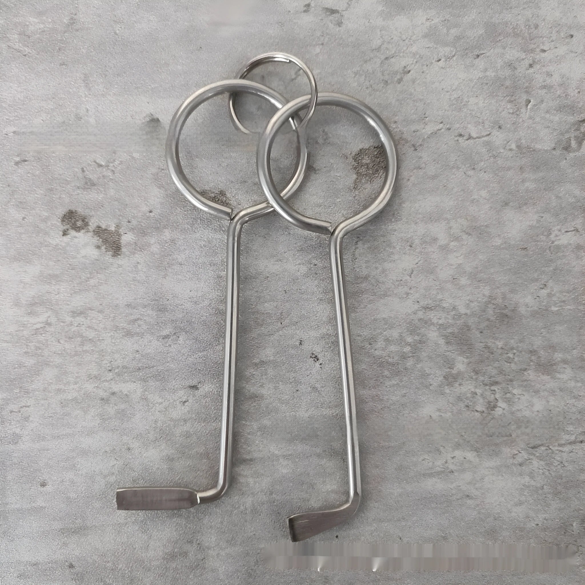 Two metal alloy wrench tools from a portable 2-piece set for household and vehicle maintenance.