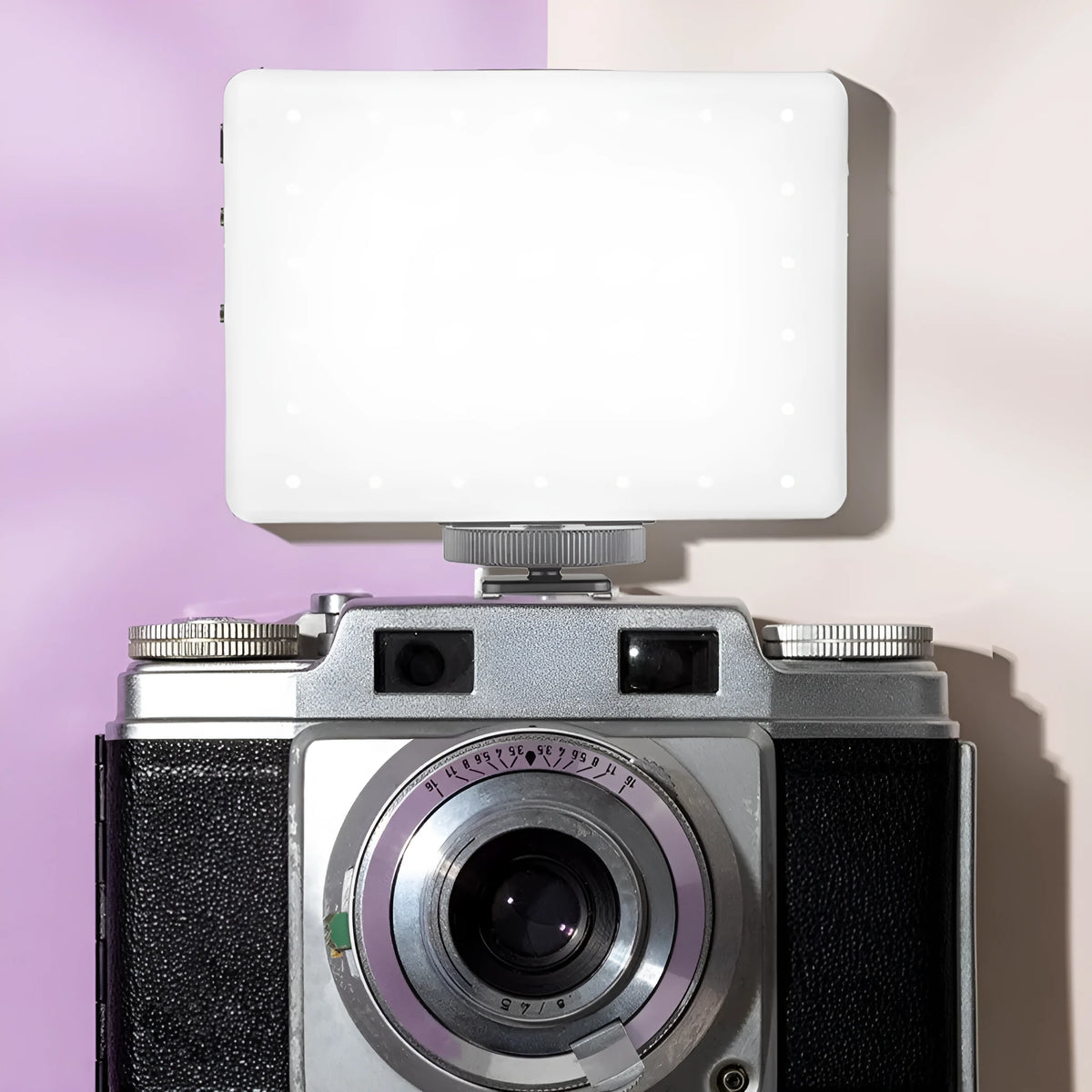 Pocket LED fill light with clip mount attached to mobile phone for photography lighting