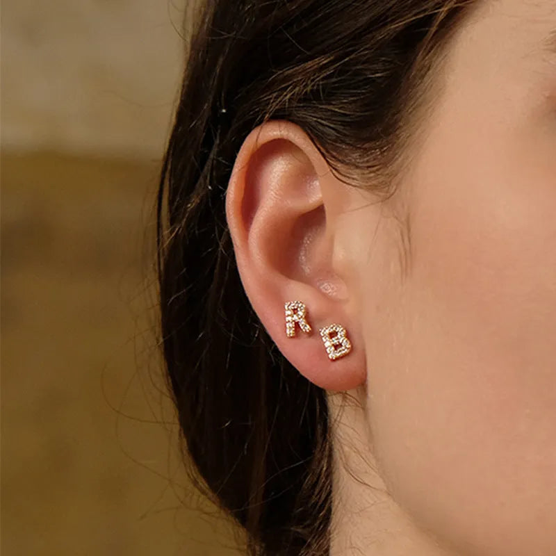 Single brass gold plated letter E earring with clear zircon stone and copper post backing