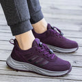 Men's and women's black mesh slip-on casual shoes with an elastic band across the instep.