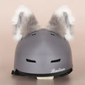 Cute cartoon plush decoration attached to a ski helmet