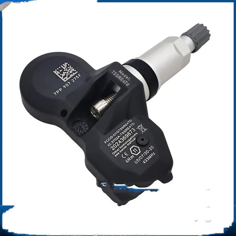 Audi car tyre pressure monitoring sensor with black housing shown alongside packaging