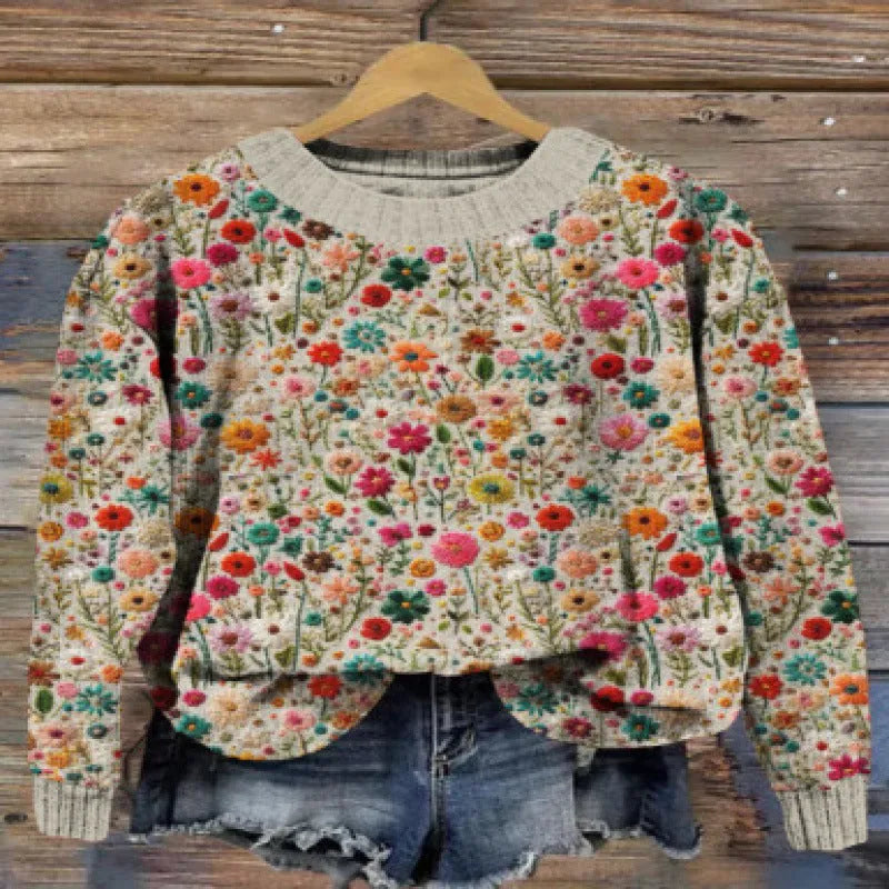 Round neck sweater with a small floral digital print pattern on the front.
