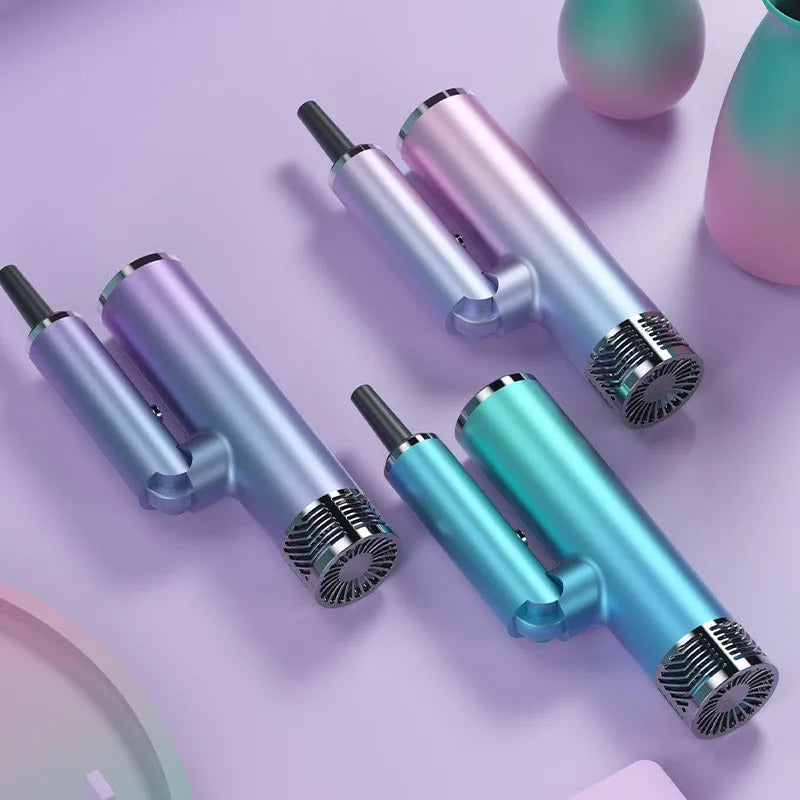 Green foldable hair dryer with collapsed handle next to open suitcase.