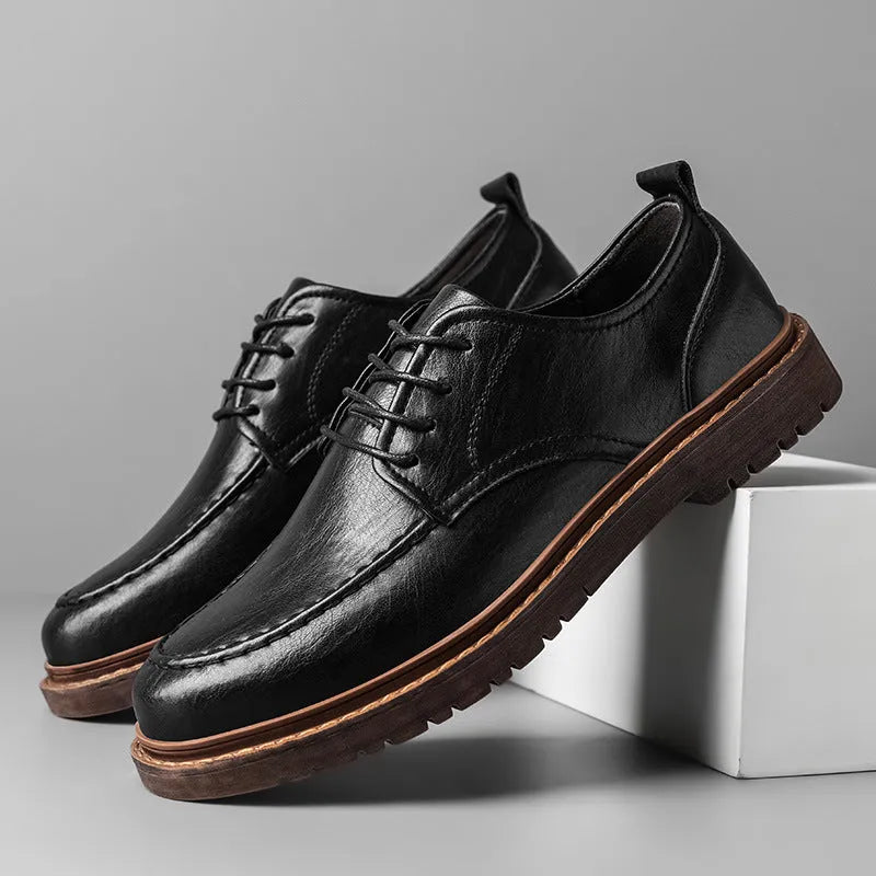 Men's black and brown casual leather shoes with a round toe and flat rubber sole.