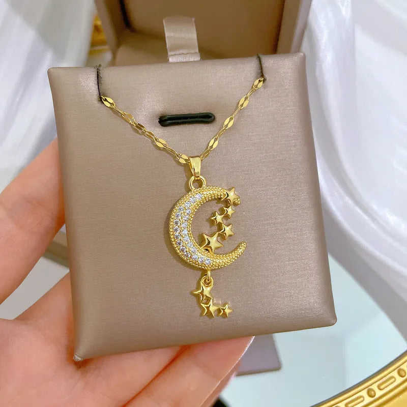 Geometric moon pendant necklace with diamond accents on stainless steel chain, copper pendant with tassel styling