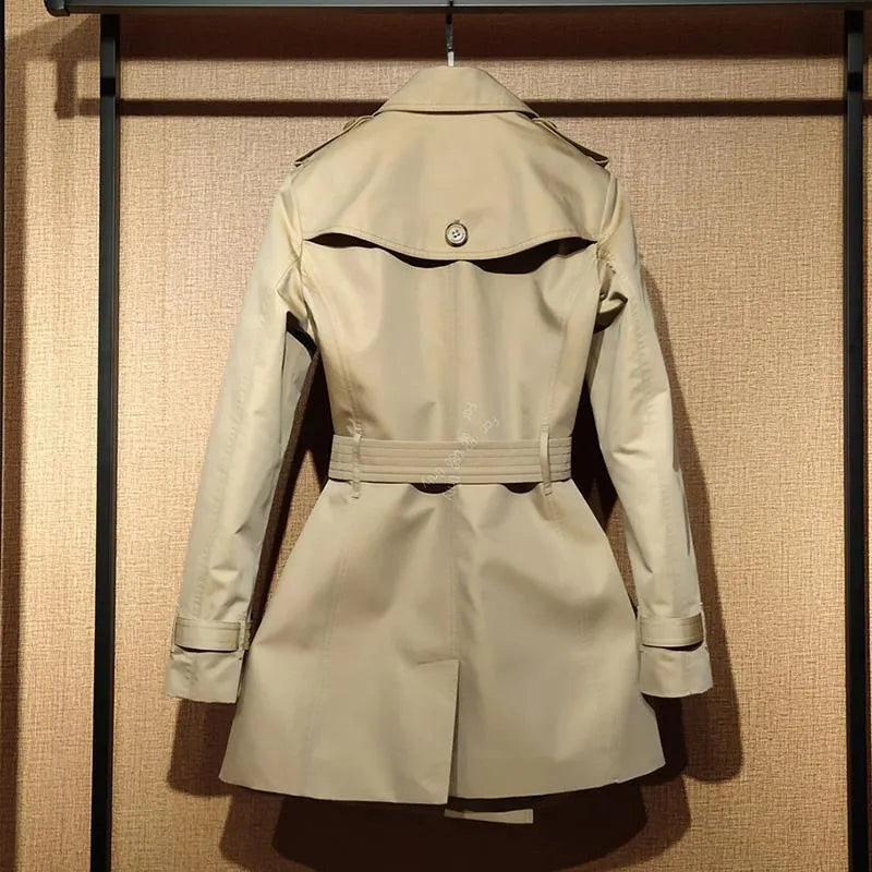 Khaki women's double breasted trench coat with flight sleeves showing button detailing