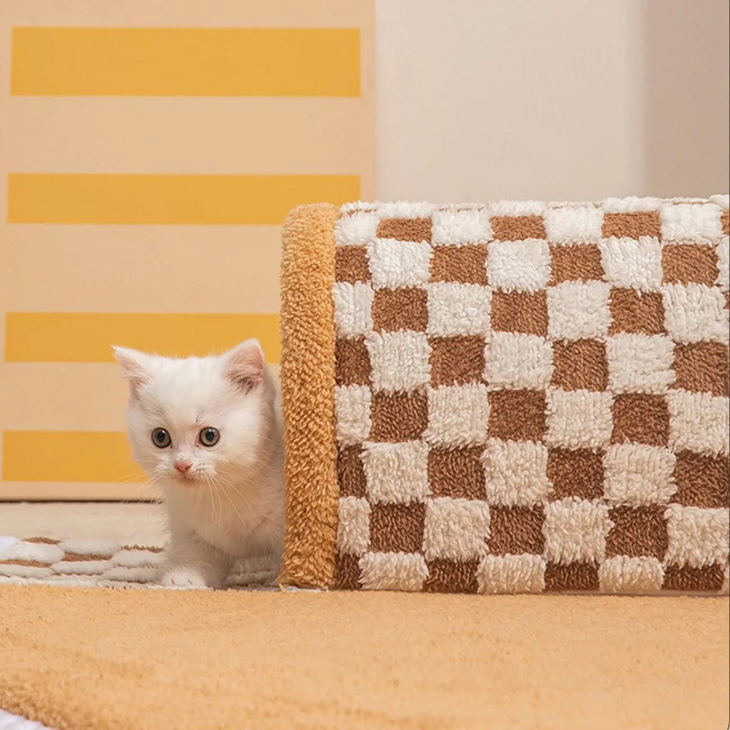 A coffee-coloured plush fan-shaped pet bed with an attached tunnel for cats and dogs.