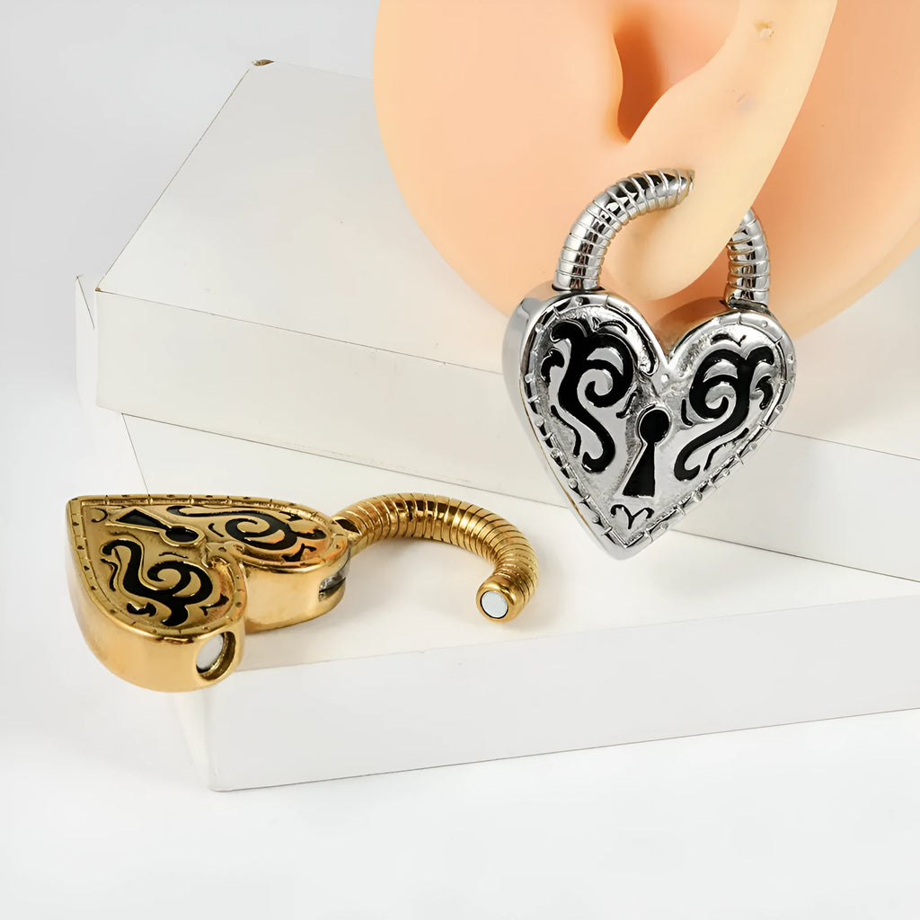 Women's heart-shaped stainless steel earrings in gold or steel colour options for ear piercings