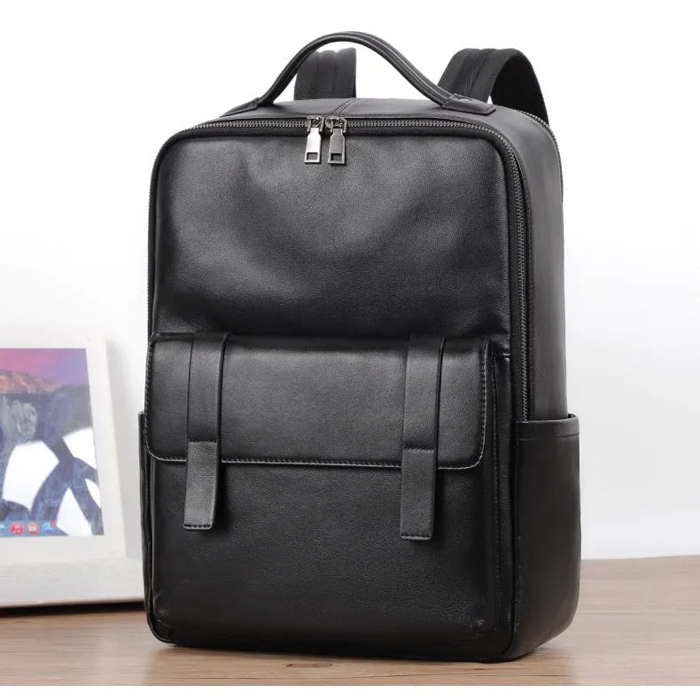 Large black genuine leather men's backpack with woven detail and a curved back panel.