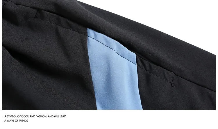 Black and grey loose fit sports shorts with elasticated waistband and tie closure