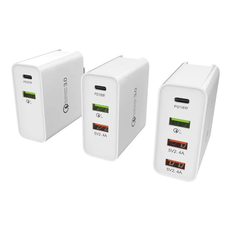 White multi-port fast charger with PD and QC support plugged into a wall socket