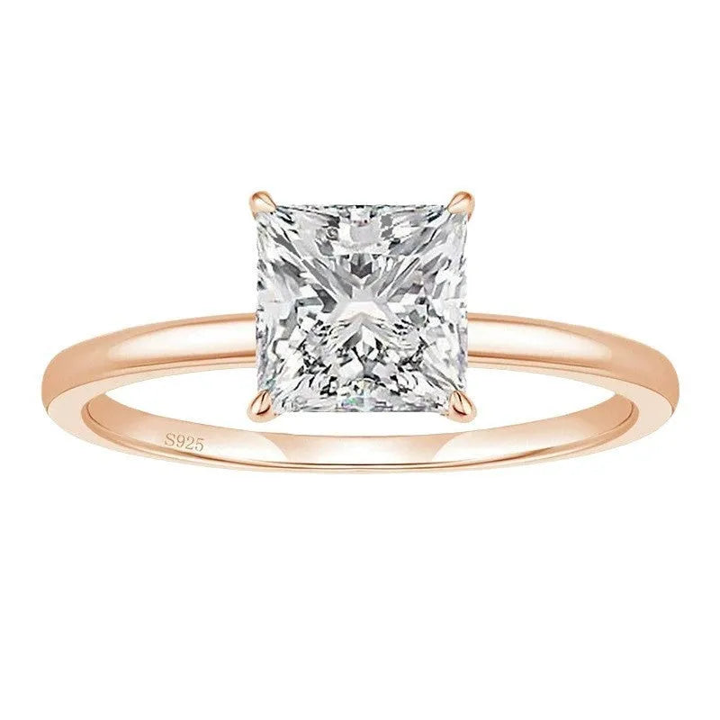 Simple geometric sterling silver ring with round stone on a woman's hand, shown in silver, gold, and rose gold colours.
