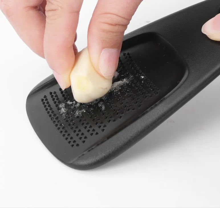 Six kitchen gadgets stacked together with cleaning brush in colour box packaging
