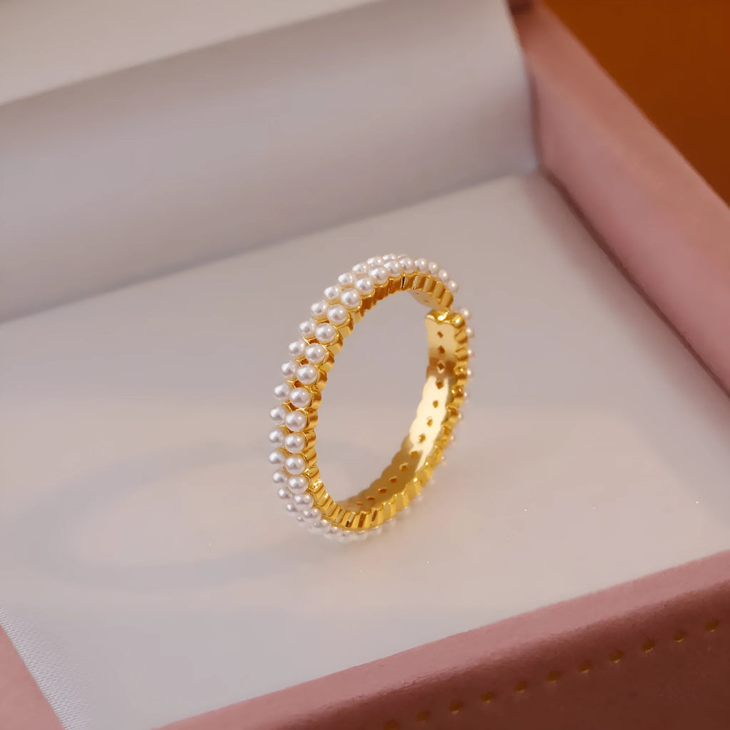 Gold geometric open mouth women's ring with central pearl on copper with electroplated finish
