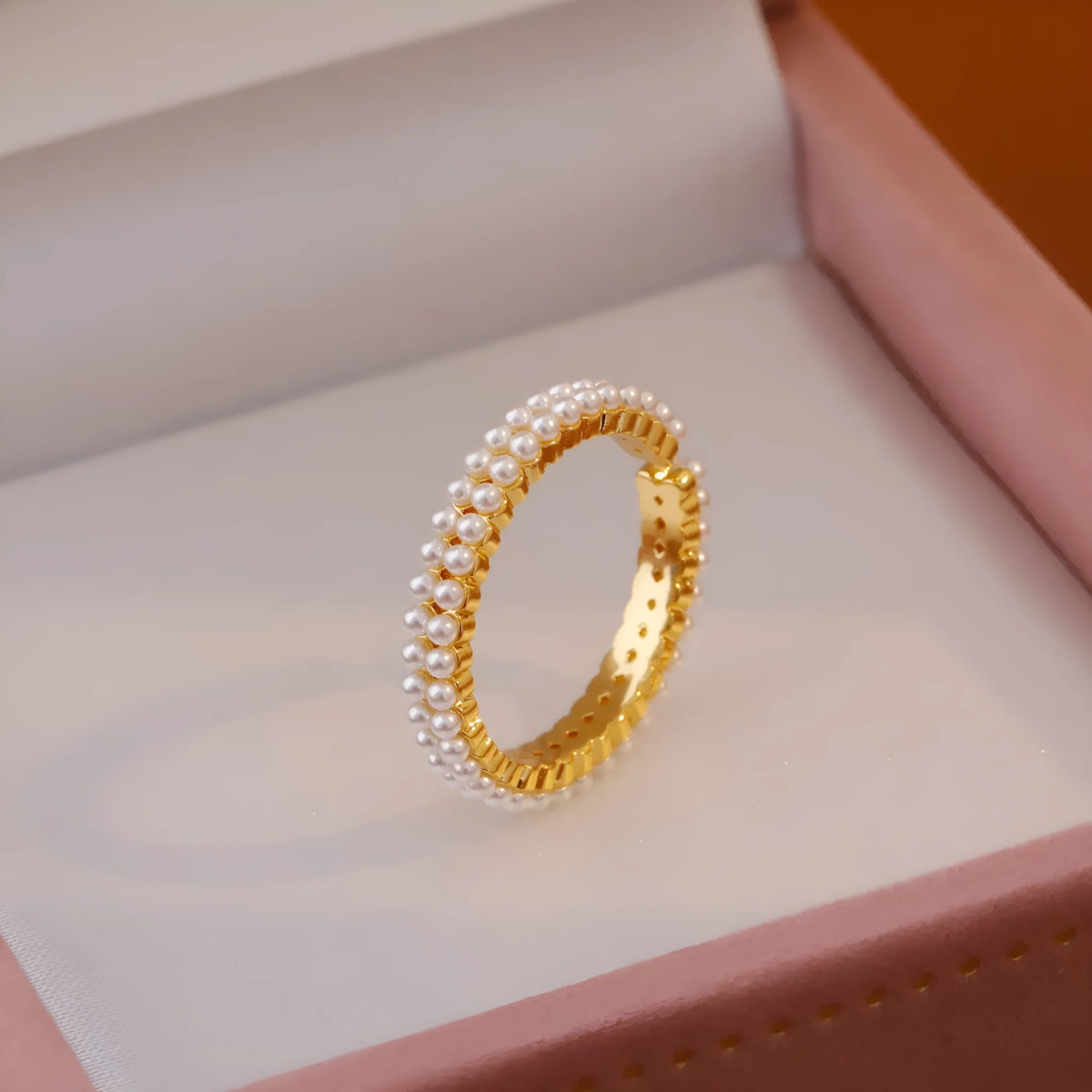 Gold geometric open mouth women's ring with central pearl on copper with electroplated finish