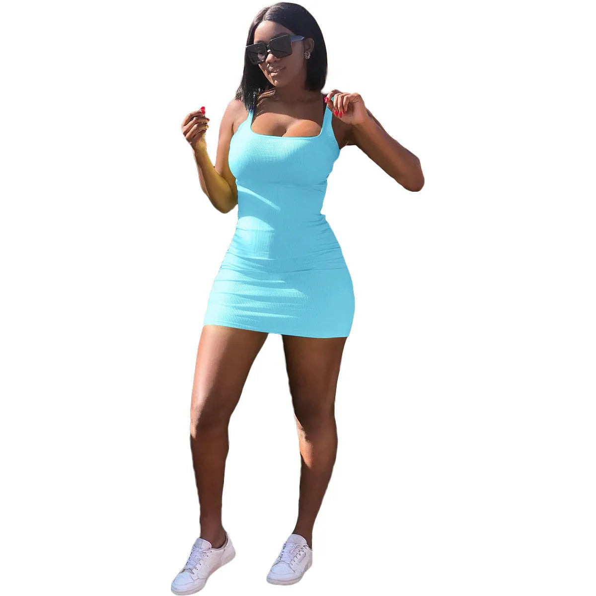 Woman wearing a slim fit casual dress with a big U-neck, sunken stripe straps, and princess sleeves.