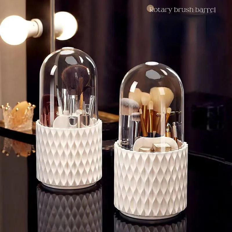 White rotating transparent makeup brush storage organiser with dust cover on desktop