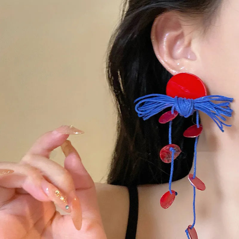 Women's geometric earrings with cloth base and silver needle-blue resin flower accents