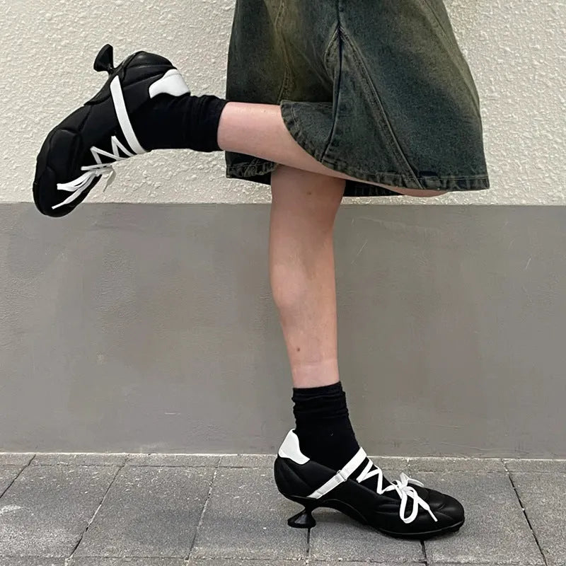 Women's silver lace-up bow sports shoes with round toe and mid-heel on a white background.
