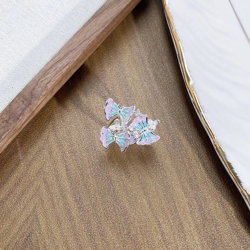 Adjustable opening copper ring featuring an insect motif with a dripping oil texture finish.