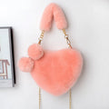 Medium sized soft plush heart-shaped women's handbag in a choice of fourteen colours with a synthetic leather lining
