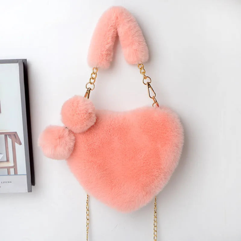 Medium sized soft plush heart-shaped women's handbag in a choice of fourteen colours with a synthetic leather lining