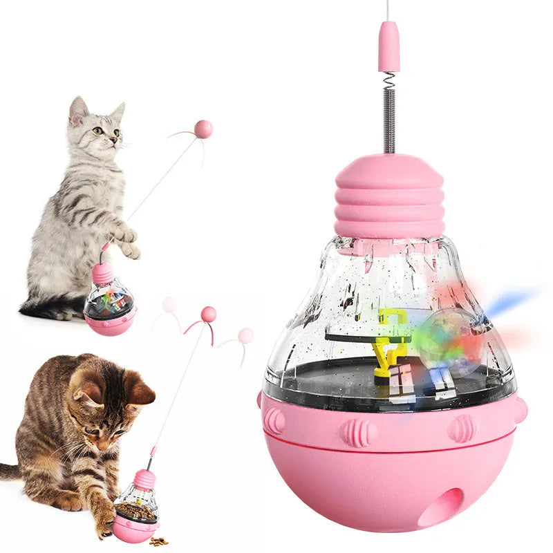 Interactive cat wand toy with rocking base, teaser attachment, and food dispenser in pink, purple or yellow colours
