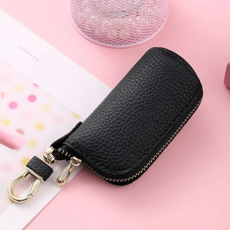 Black PU zip key case for men and women, shown closed with a key ring attached.