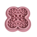 Silicone pet slow feeder licking pad mat in blue colour on a wooden floor.