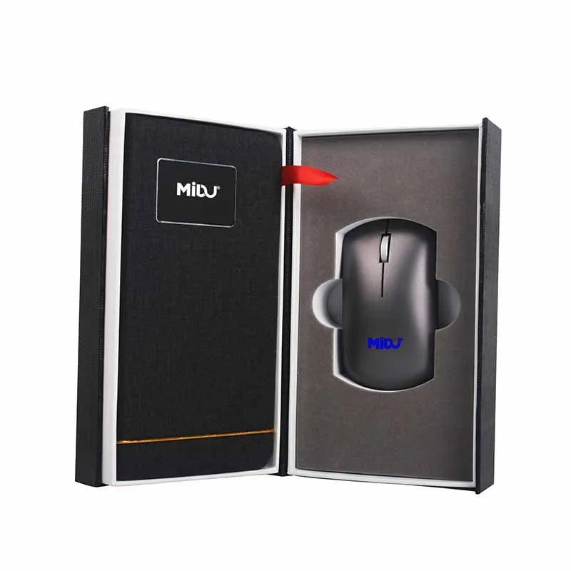Folding wireless charging mouse pad set with separate Bluetooth mouse on a desk.